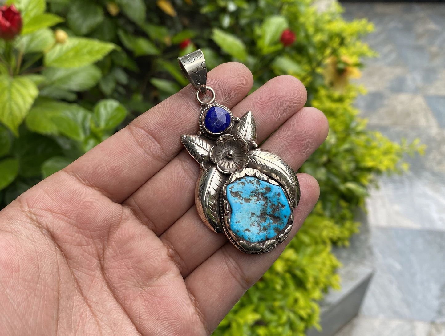 Aesthetic Natural Turquoise Pendant for daily wear, Floral details on Tibetan silver and adornment of Raw Lapis, Unique piece, Boho fashion.