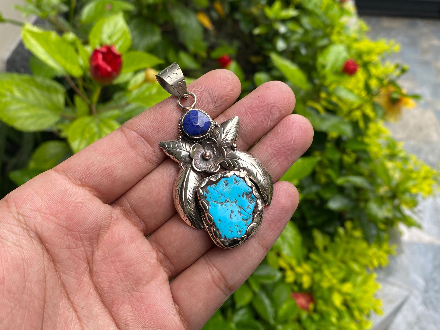 Aesthetic Natural Turquoise Pendant for daily wear, Floral details on Tibetan silver and adornment of Raw Lapis, Unique piece, Boho fashion.