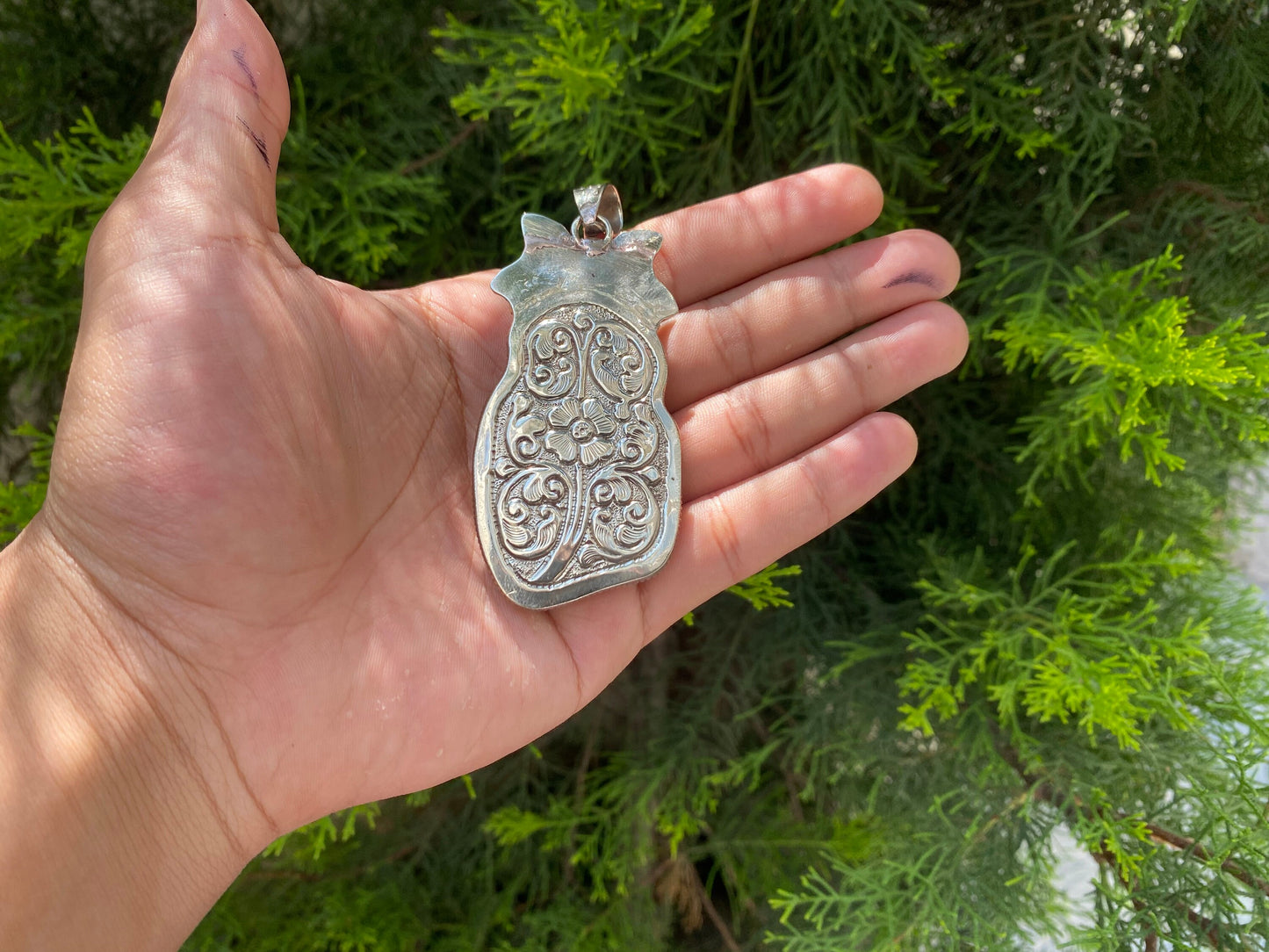 Ancient Strength: Tribal Barbarian Head Carved Tibetan Silver Pendant in Water Buffalo Bone and added Turquoise.
