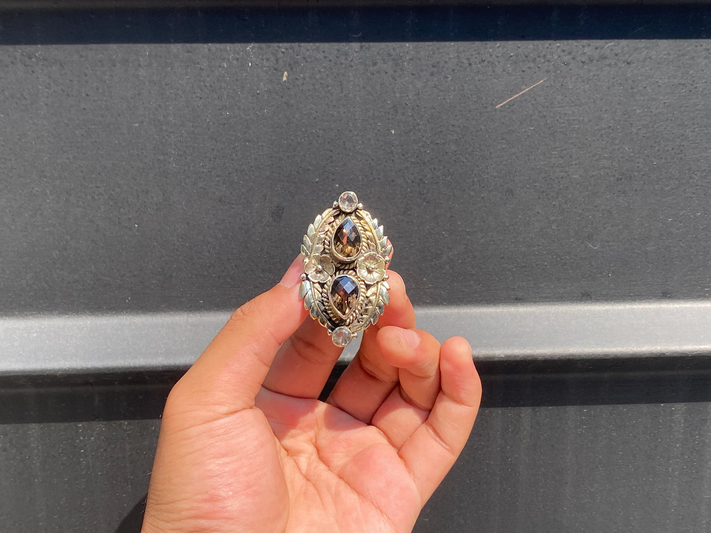 Big Hammered Floral designed Ring Adorned with Smoky Quartz and White Topaz.