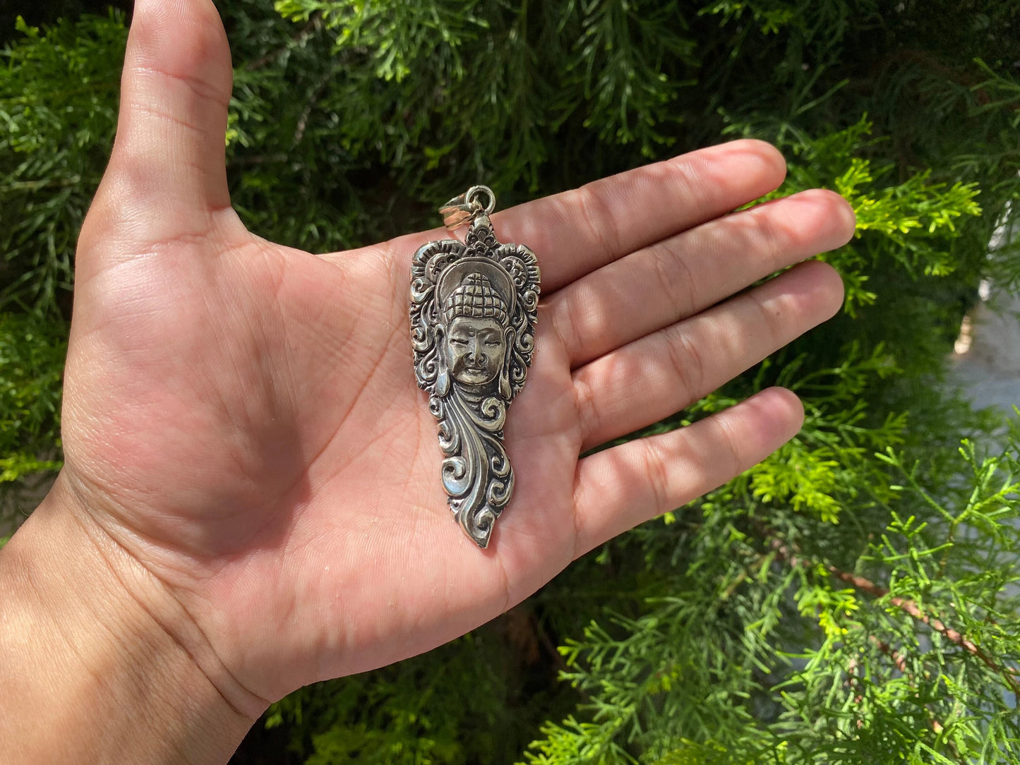 Buddha Face with Intricate Floral Motifs, Artistic Tibetan Silver Pendant.