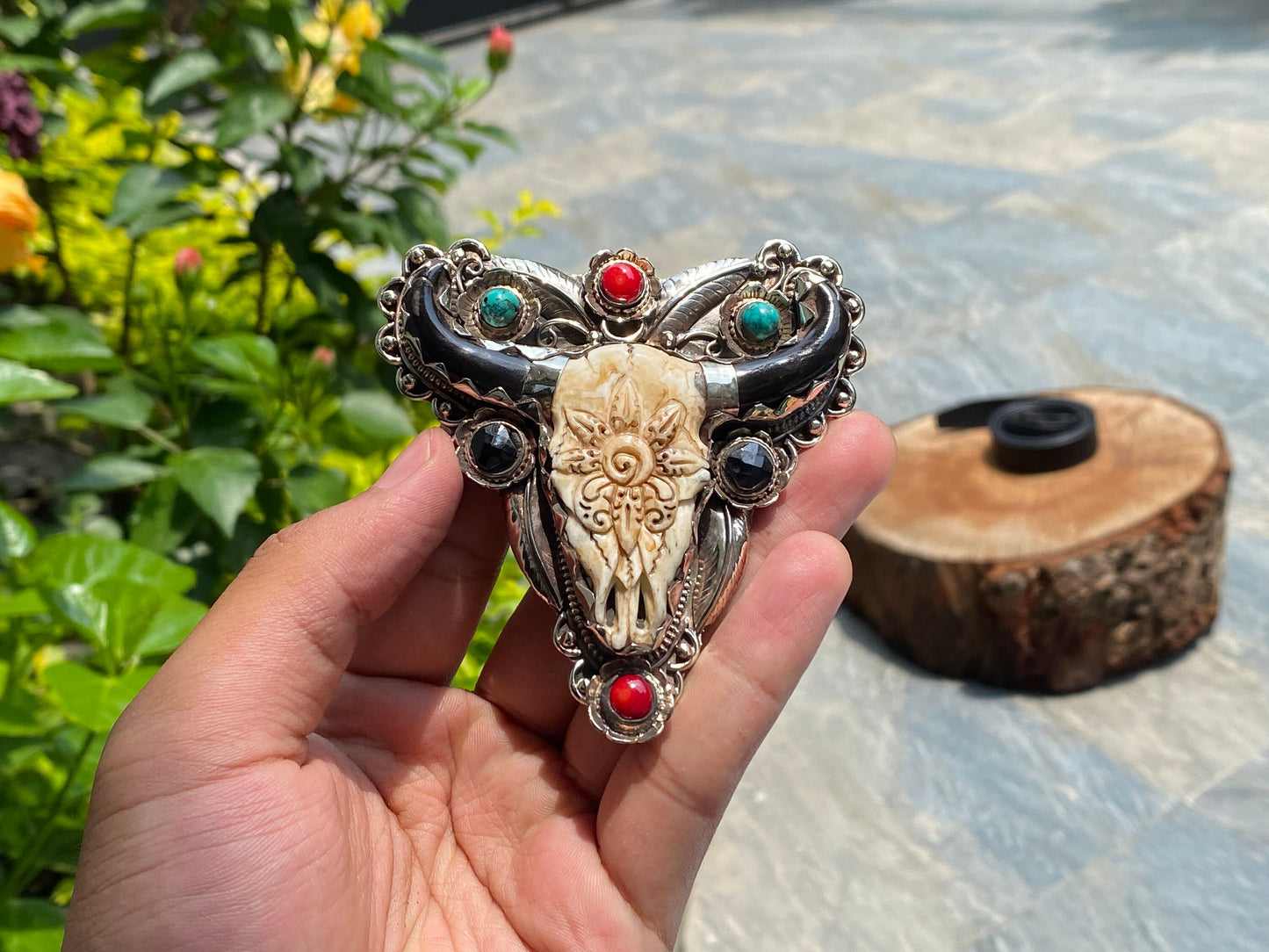 Bulls head shaped Tibetan Silver Belt Buckle adorned with Natural Turquoise, Red Coral, Black Onyx. Floral Design carved on buffalo bone.
