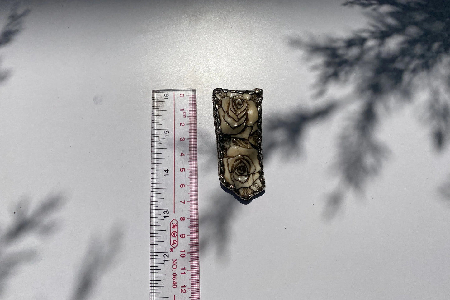 Silver Blossoms: Floral Tibetan Silver Pendant, Tibetan Silver Pendant with Floral Motifs.