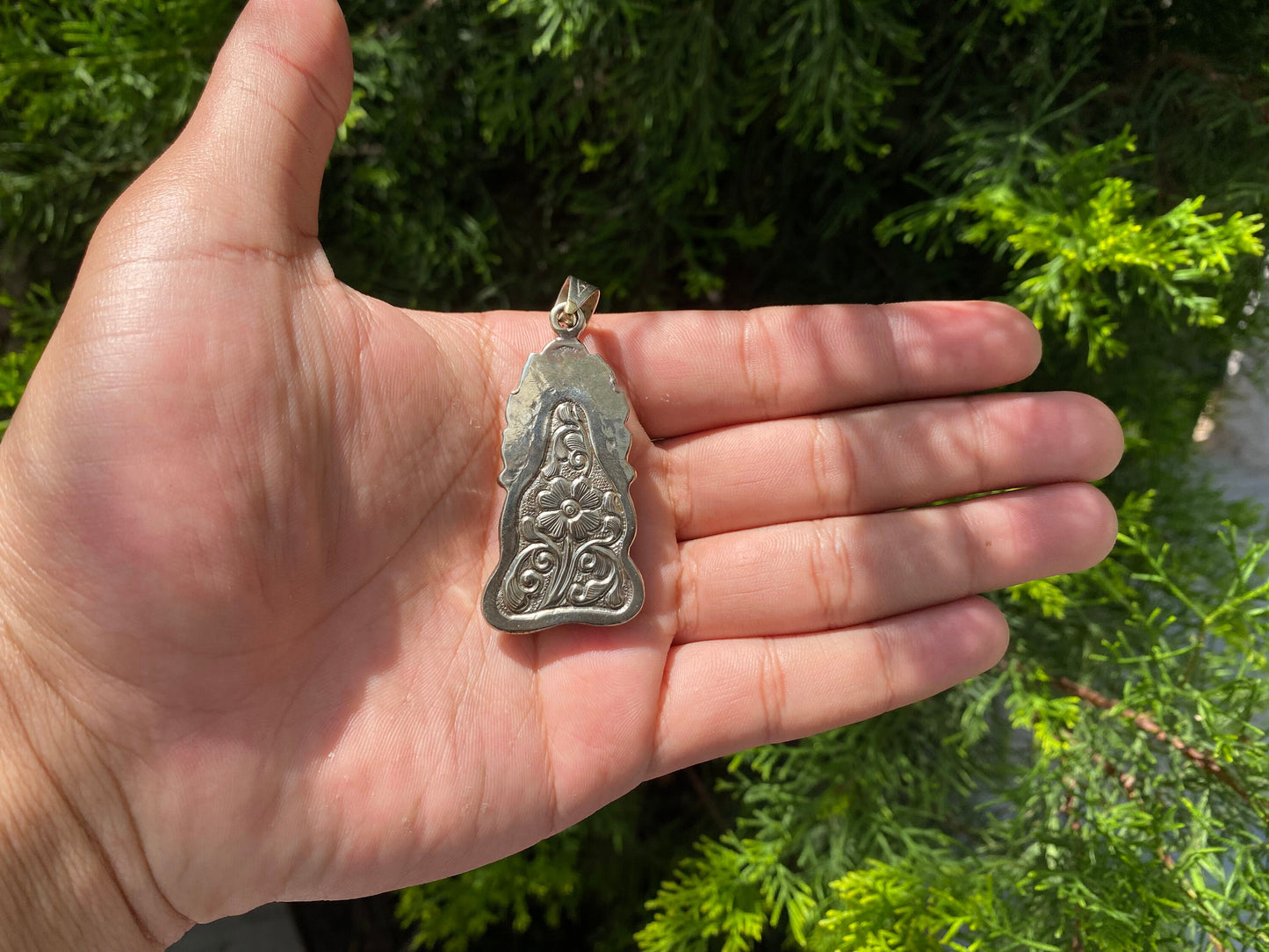 Harmony and Heritage: Buddha on Buffalo Bone with Tibetan Silver Surround, Buddha Carved Buffalo Bone Pendant in Tibetan Silver.