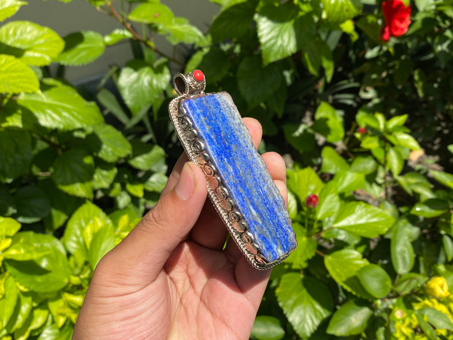 Natural Raw Lapis Pendant adorned with Tibetan Silver & Red Coral, Hammered Floral Design, Aesthetic Pendant for daily wear, Unique Pendant.