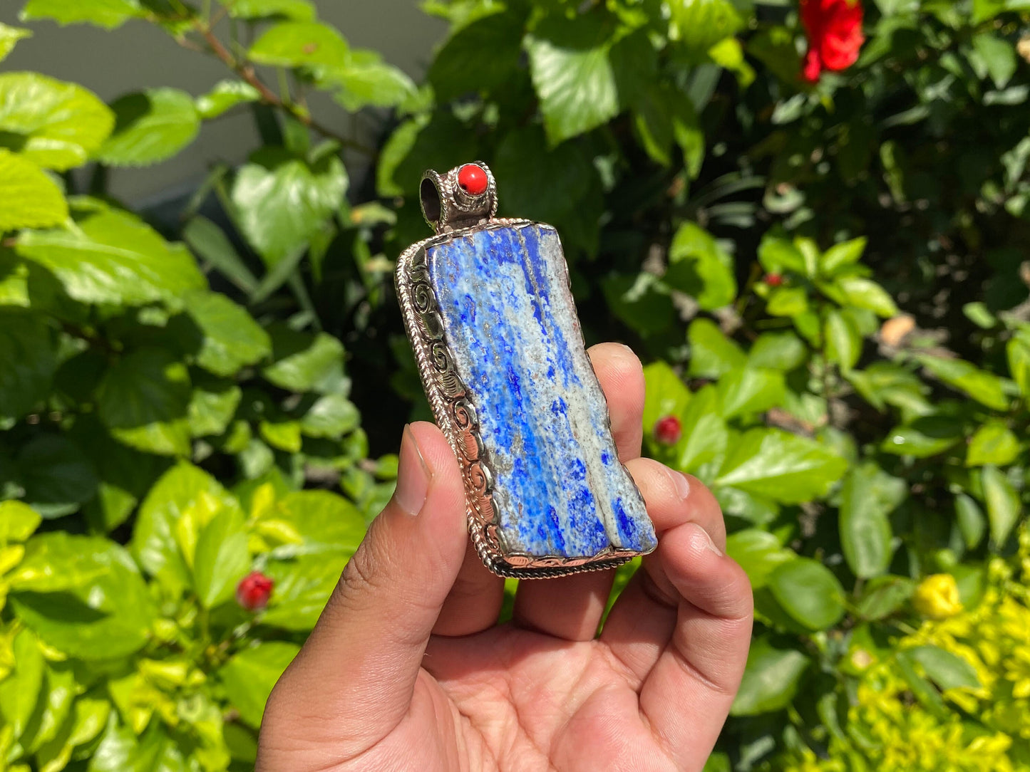 Natural Raw Lapis Pendant adorned with Tibetan Silver & Red Coral, Hammered Floral Design, Aesthetic Pendant for daily wear, Unique Pendant.