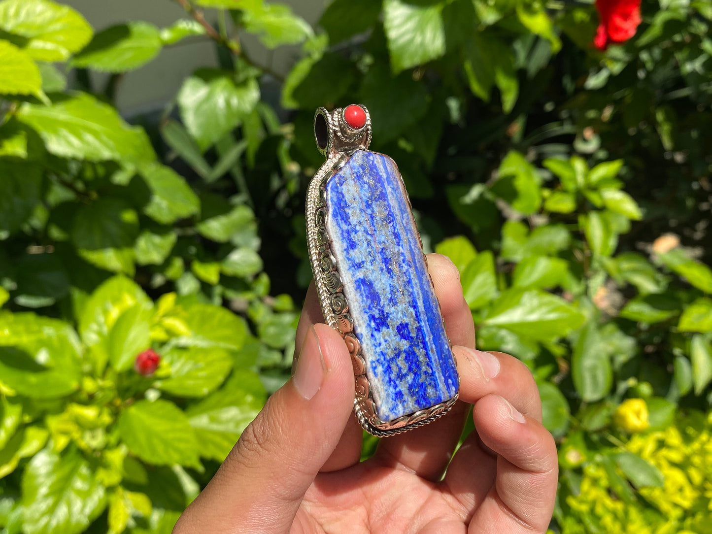 Natural Raw Lapis Pendant adorned with Tibetan Silver & Red Coral, Hammered Floral Design, Aesthetic Pendant for daily wear, Unique Pendant.