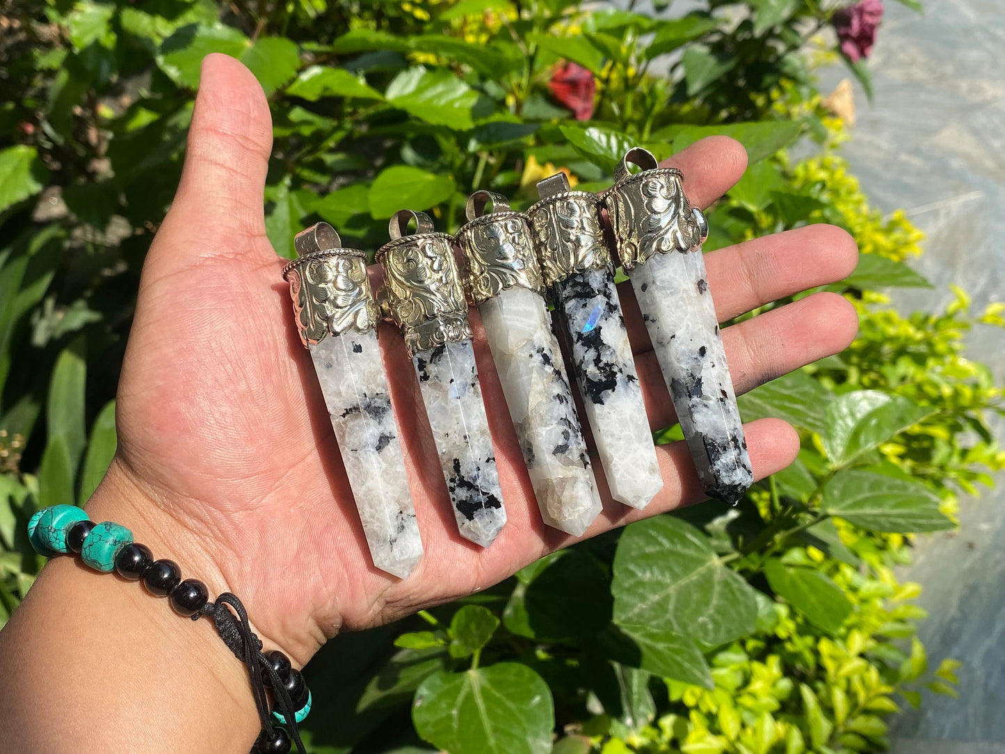 Unisex Healing Pendant: Stylish and Unique from Nepal, Moonstone pendant adorned with Black onyx.
