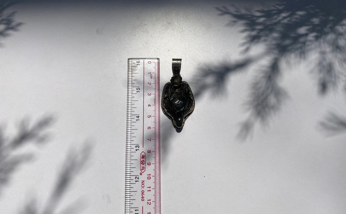 Spirit of the Wilderness: Tibetan Silver Wolf Head Pendant, Wolf Head Amulet in Tibetan Silver.