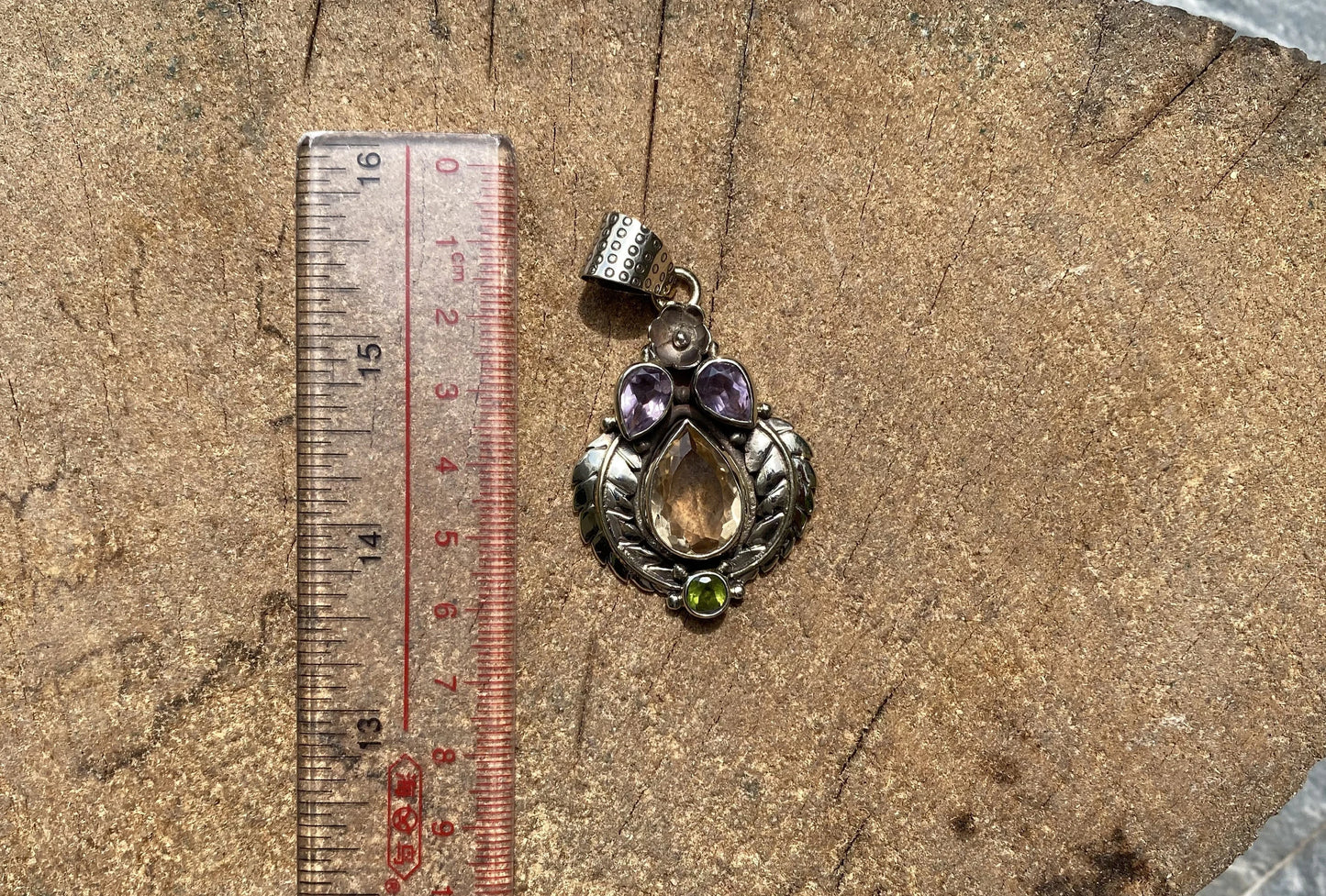 Unique Tibetan silver pendant adorned with Smokey Quartz, Peridot and Amethyst, Handmade floral design, Collectible pendant for daily wear.