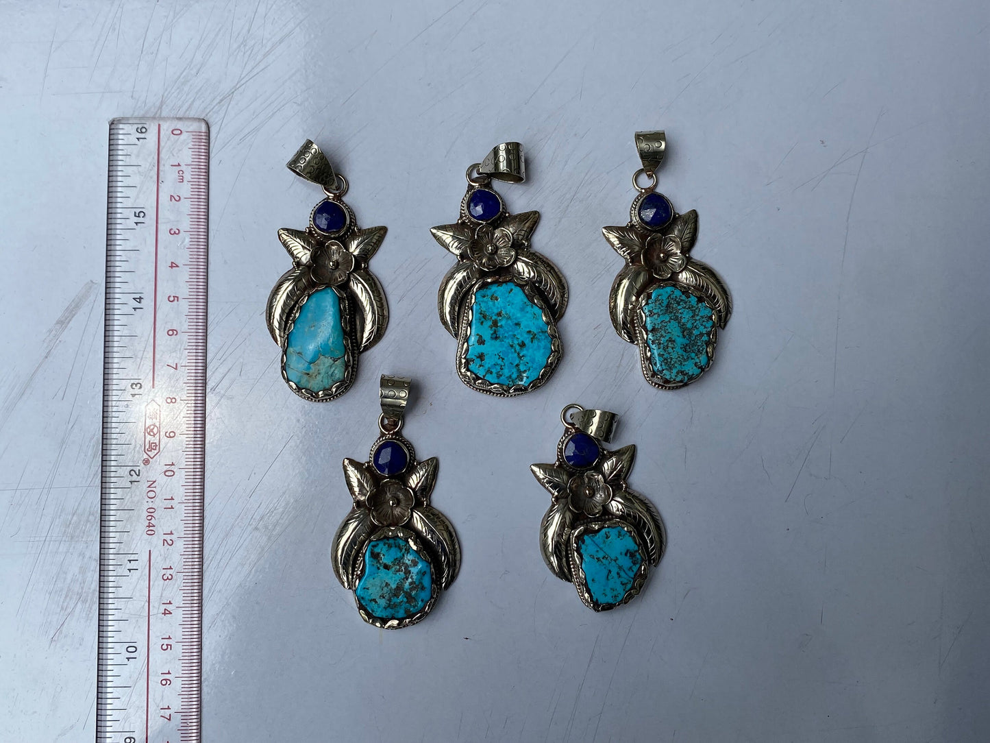 Aesthetic Natural Turquoise Pendant for daily wear, Floral details on Tibetan silver and adornment of Raw Lapis, Unique piece, Boho fashion.