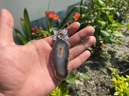 Enchanted Earth: Agate Slice Pendant Adorned with Tibetan Silver,Agate Slice Pendant with Tibetan Silver.