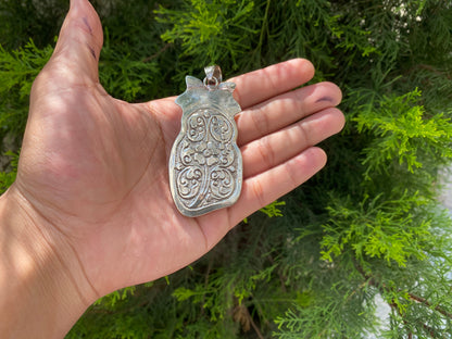 Ancient Strength: Tribal Barbarian Head Carved Tibetan Silver Pendant in Water Buffalo Bone and added Turquoise.