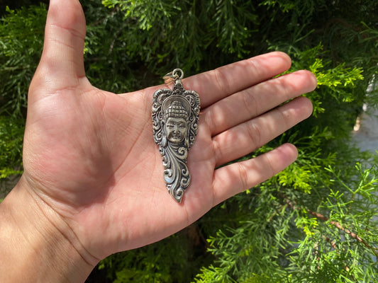 Buddha Face with Intricate Floral Motifs, Artistic Tibetan Silver Pendant.