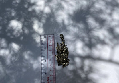 Buddha's Blooms: Floral Design Carved Tibetan Silver Buddha Face Pendant, Tibetan Silver Pendant with Buddha Face and Floral Motifs