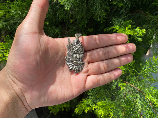 Buddha's Blooms: Floral Design Carved Tibetan Silver Buddha Face Pendant, Tibetan Silver Pendant with Buddha Face and Floral Motifs