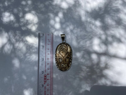 Bull Spirit: Water Buffalo Bone Carving in Tibetan Silver Pendant, Tibetan Silver Pendant with Detailed Bone Carving.