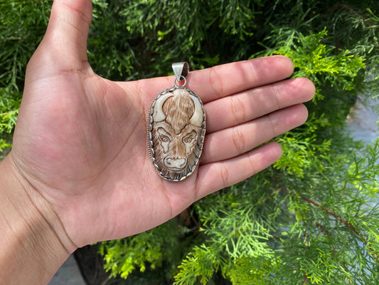 Bull Spirit: Water Buffalo Bone Carving in Tibetan Silver Pendant, Tibetan Silver Pendant with Detailed Bone Carving.