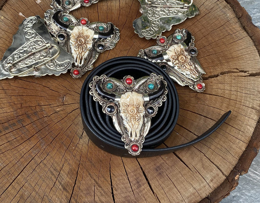 Bulls head shaped Tibetan Silver Belt Buckle adorned with Natural Turquoise, Red Coral, Black Onyx. Floral Design carved on buffalo bone.