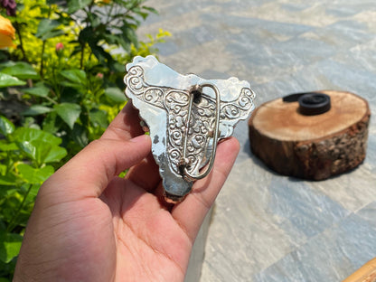 Bulls head shaped Tibetan Silver Belt Buckle adorned with Natural Turquoise, Red Coral, Black Onyx. Floral Design carved on buffalo bone.