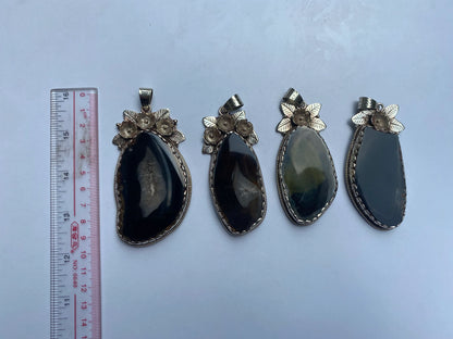 Handcrafted by Mother Nature: Agate Slice Pendant decorated with Tibetan Silver Details.
