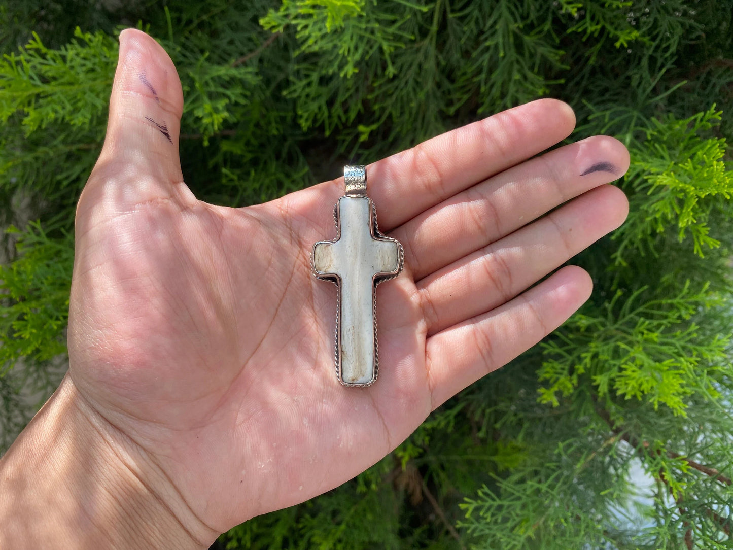 Sacred Harmony: Intricately Carved Buffalo Bone Cross with Tibetan Silver, Buffalo Bone Cross Enhanced with Tibetan Silver.