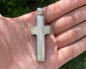 Sacred Harmony: Intricately Carved Buffalo Bone Cross with Tibetan Silver, Buffalo Bone Cross Enhanced with Tibetan Silver.