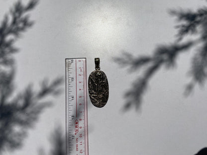 Soul Sentinel: Carved Skull on Tibetan Silver Amulet, Carved Skull Amulet in Tibetan Silver.