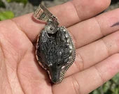 Spirit of the Wilderness: Tibetan Silver Wolf Head Pendant, Wolf Head Amulet in Tibetan Silver.