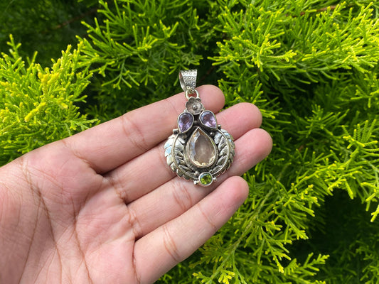 Unique Tibetan silver pendant adorned with Smokey Quartz, Peridot and Amethyst, Handmade floral design, Collectible pendant for daily wear.